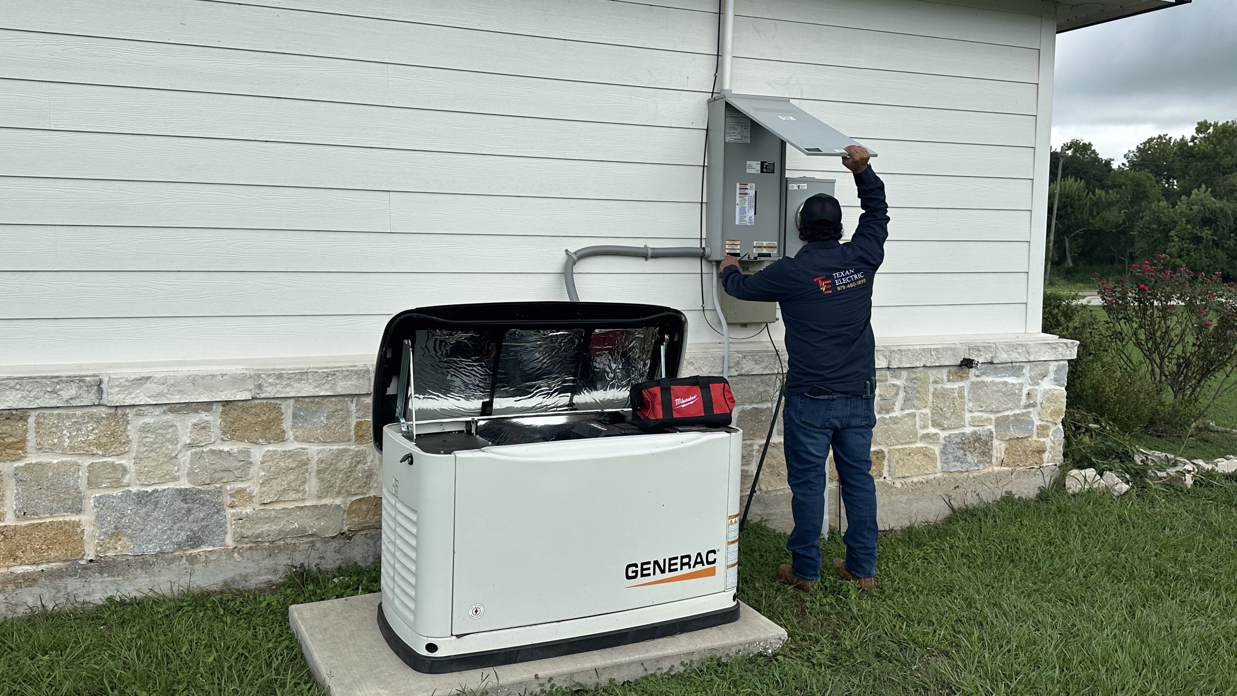 Texan Electric employee working at a Generac generator installation